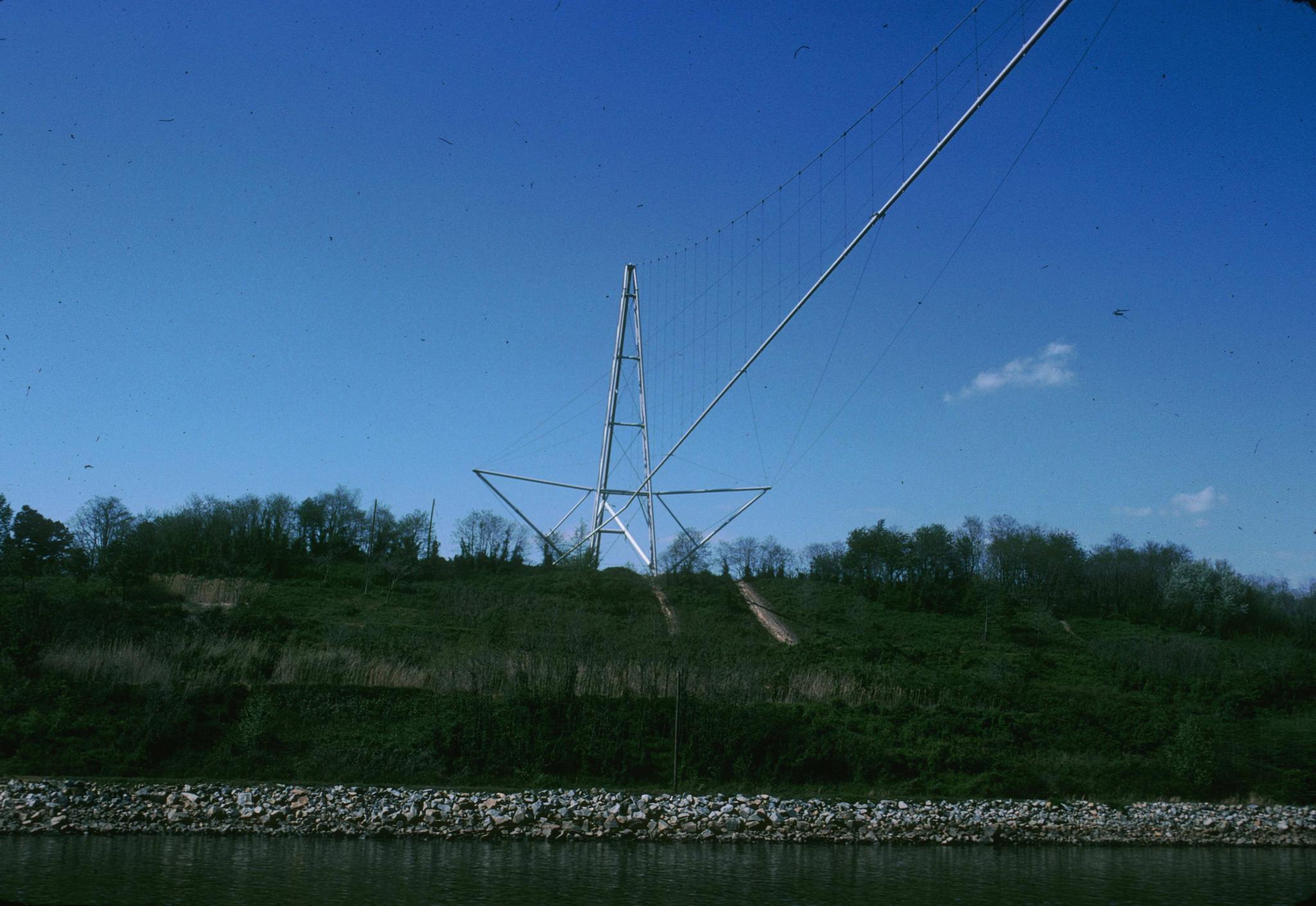 Photograph of an unidentified pipe suspension bridge over the C&D Canal in…